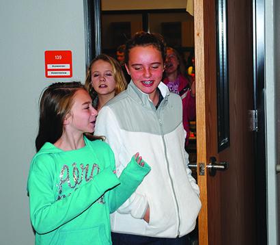  Ira sixth grade students (l-r) Emily Lowry, Avery Schiffner and Bailey Hall share a laugh during the first day back in school after the winter break. 