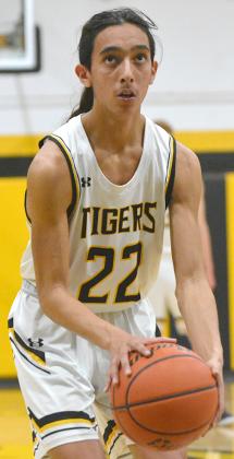 Snyder junior Michael Jaramillo prepared to shoot a free throw during the Tigers’  65-54 win over Midland Greenwood last week. The Tigers will host Big Spring today at 7:30 p.m. in their final regular season game.