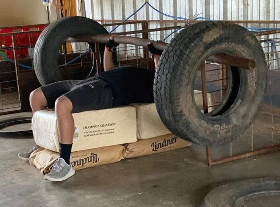 Collier used a home-made bench press. Collier is one of many local athletes who are without access to a gym due to the concerns over the COVID-19 pandemic.
