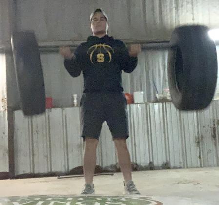 junior Jax Collier lifted using a home-made weight set. Stewart and Collier are both members of the Snyder High School football program and are doing their best to stay in shape while quarantined.