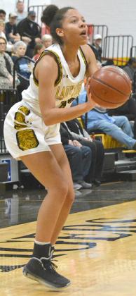 Snyder junior Kamiah Davis prepared to shoot a three-pointer during a game this past season. Davis led the Lady Tigers with 12.9 points per game and will play a big role for the 2021 Lady Tigers.