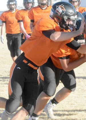 Ira senior Karson Valentine worked on his blocking during practice at Bulldog Stadium Tuesday. The Bulldogs head into Friday’s game against Hermleigh looking to finish the season undefeated for the second straight season.