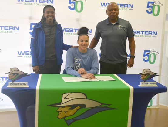 Western Texas College sophomore Kimberly Best (center) posed for pictures with head girls basketball coach Darryl Davis (right) and assistant coach Brechelle Beachum Thursday. Best signed a National Letter of Intent to continue her collegiate basketball career with The University of Texas of the Permian Basin.