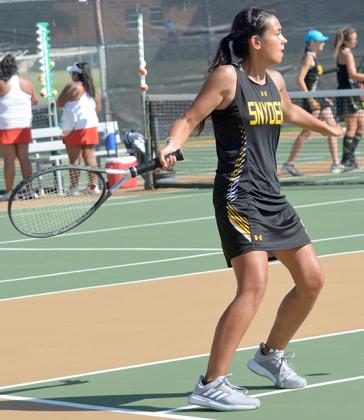 Snyder’s Kynzie Avalos prepared to hit the ball during a match against Sweetwater Tuesday. Avalos secured wins in both her doubles and singles matches.