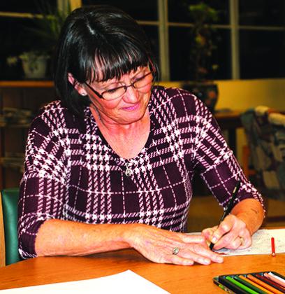 D’Ann Preston enjoyed a night of coloring and relaxation at the Scurry County Library Thursday. Fifteen people participated in the library’s first adult coloring activity night. Library Director Linda Jones said she was pleased with the turnout and the  next coloring night will be on March 17.