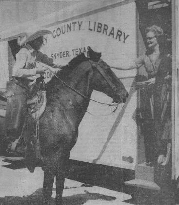 Larry Farr (left) checked out a book at Scurry County LIbrary’s bookmobile during one of its stops in Hermleigh in 1959. Pictured with Farr is bookmobile operator Mrs. Harry Lee. 