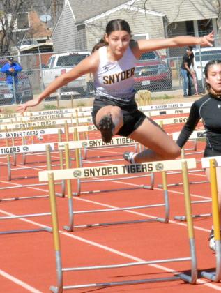 nyder’s Madison Yescas cleared the hurdle during the Canyon Reef Relays at Tiger Stadium Thursday. Yescas ran both the 100-meter and the 300-meter hurdles, medaling in both races.