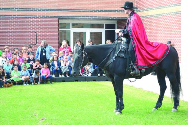 The Texas Tech Masked Rider, along with his horse, Fearless Champion, were at Snyder Primary School today to visit students and answer questions. The Masked Rider’s visit was part of School Pride Day, one of the different spirit days being observed during homecoming week at Snyder ISD.