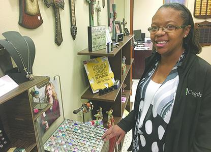 Chantell McGaha, who works in the medical records department at Cogdell Memorial Hospital, looks at the jewelry available in the Auxiliary’s gift shop. The Snyder High School graduate said each day brings new challenges in the medical field.