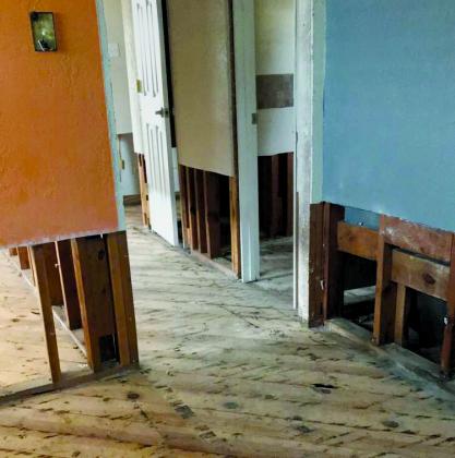 Damaged floors and and sheetrock have been removed from Ida Millican’s home in the 2200 block of 45th Street. Millican’s home was severely damaged by sewage discharged in mid-July and she has been living in a motel while repairs are made to her home.