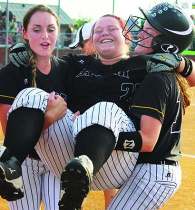 2015 Snyder graduate Alexis Prouxl (center) was lifted in celebration by 2015 graduate Tayor Hinojos (left) and  2017 graduate Hailey Morris. All three players are members of The Snyder News All-Decade team. 