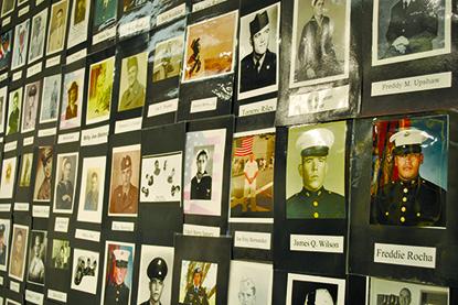 Veterans’ photos line a wall at the Scurry County Museum.