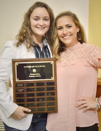Natalee James (left) received the Outstanding Female Athlete award from head girls’ basketball coach T’Leah Eicke. James played basketball, volleyball and softball.