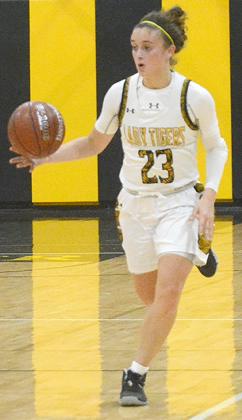 Snyder senior Natalee James dribbles down the court during a game this past season. James is committed to play basketball at Hardin-Simmons University.