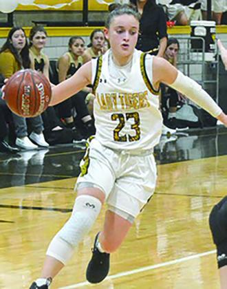 2020 graduate Natalee James prepared to perform a cross-over during a game last season. James made her second appearance in The Snyder News All-Decade series.