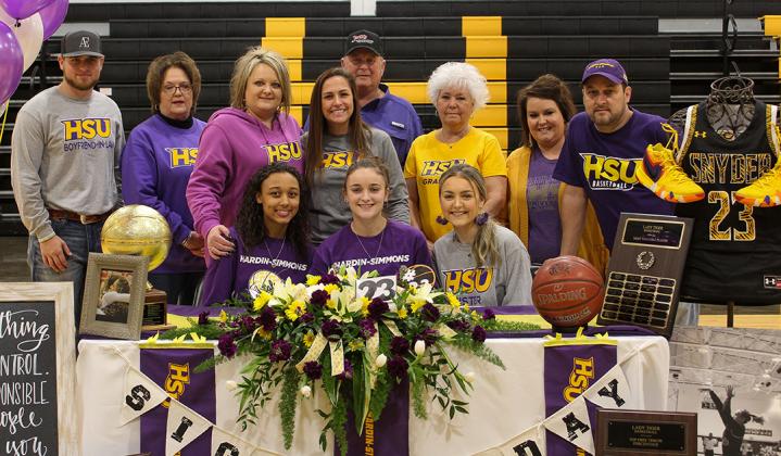 family and friends gathered as Snyder senior Natalee James (center, front row) signed her National Letter of Intent to play basketball for Hardin-Simmons University in Tiger Gym Monday.