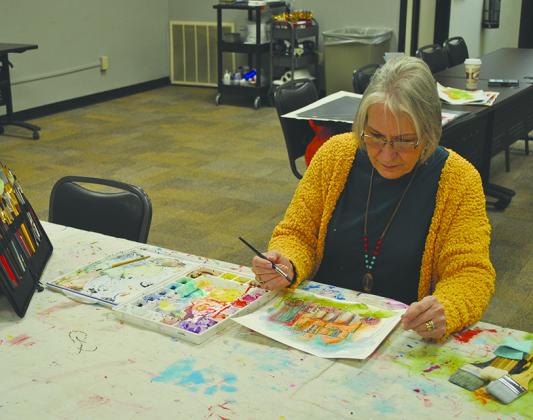 Class instructor Nathalie Kelley  took time to do some painting on her own.