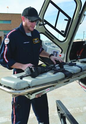  Native Air paramedic Jason Guynes checked the stretcher in the helicopter.