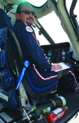 Native Air pilot John Davis runs through a pre-flight checklist before taking off. 