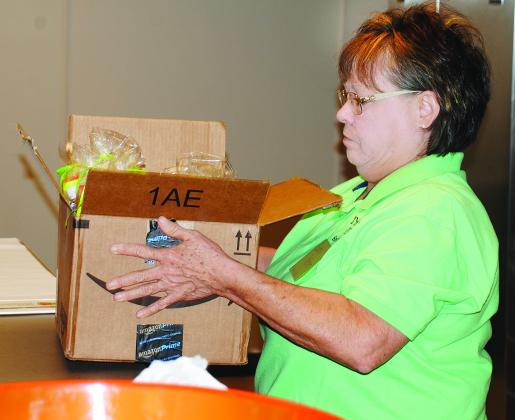 Betty Potter delivers a box filled with goody bags for new Snyder ISD teachers and staff members at the district’s orientation today. The bags were filled with items donated by members of Trinity United Methodist Church.