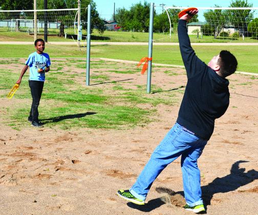 Talib Terry (left) and Nicholas Martinez played catch at North Park during Saturday’s fall festival benefitting Snyder Community Resource Center, In Harmony Community Club and PEACE Kids. 