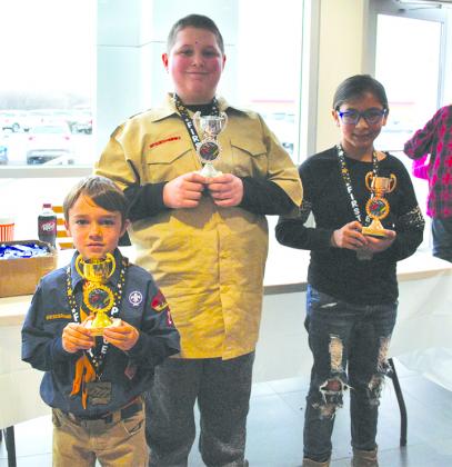 Overall top finishers at Saturday's Pinewood Derby were (l-r) Tate Grimes, first place, Joe Sikes, second place, and Emory Doporto, third place.