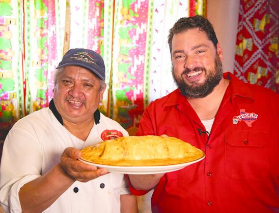 Luis Contreras (left) owner and operator of Ponderosa Restaurant, is pictured with Shane McAuliffe, host of the syndicated TV show The Texas Bucket List. The restaurant will be featured on McAuliffe’s show this weekend.