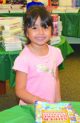 Juslyn Madrid was among the Snyder Primary School students looking for just the right book during the school’s annual book fair Tuesday. The book fair runs through Friday.