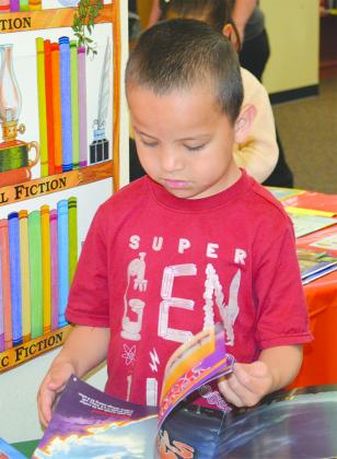 Guillermo Heredia was among the Snyder Primary School students looking for just the right book during the school’s annual book fair Tuesday. The book fair runs through Friday.