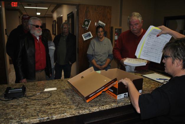 Scurry County Clerk Melody Appleton (right) held up 270 petitions containing more than 1,100 signatures calling for a rollback election to the Scurry County Clerk’s office Friday. Also pictured are the citizens who gathered and delivered the petitions, (l-r), Clay Mize, Mitch Hickman, Gayle Summers, Mel Heard, Ali Mize and Morgan Preston.