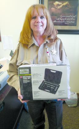 Scurry County Sheriff’s Deputy Jeanette Pritchard holds one of the door prizes that will be given away during the sixth annual Running for the Heroes 5K run, which raises money for law enforcement officers injured in the line of duty. This year’s event will be held at 9 a.m. Sept. 9 in Towle Park.