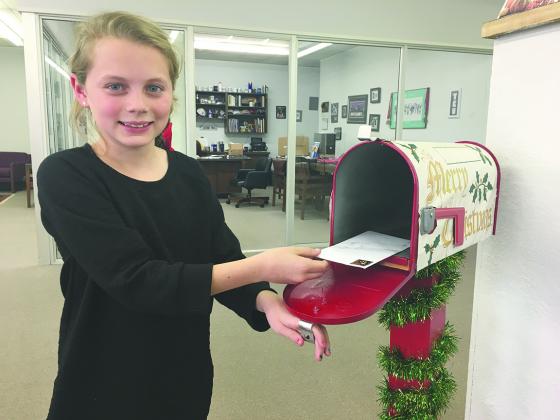 Skyler Reston dropped off her letter to Santa Claus at the Snyder Daily News office Tuesday afternoon. Children may place letters in the mailbox at the newspaper office and they will be forward to Santa Claus. All submitted letters will be published in the Christmas Eve edition of the newspaper. 