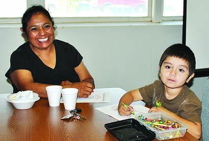 Alicia Fuentes and her grandson enjoyed coloring during Breakfast with Grandparents at Snyder Daycare Center. The center is one of eight area agencies supported by the Lend A Hand Scurry County United Way campaign.