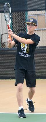 Snyder’s Shad Hodge finished a back-hand swing. The Snyder tennis team began practices Monday.