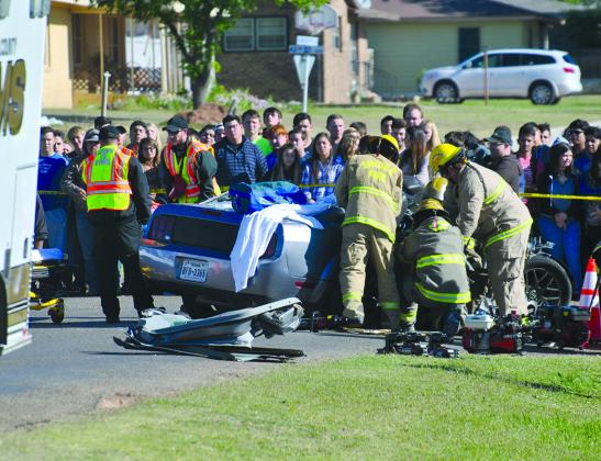 Snyder Fire Department personnel attempted to extricate “victims” during a simulated automobile accident in Towle Park Thursday. The simulated crash was part of the Shattered Dreams program, designed to show Snyder High School students the effects of drinking and driving.