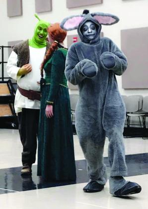 Snyder native Riley Arnold (left) will play the role of Shrek in Hardin-Simmons University’s production of Shrek the Musical this week. Pictured with Arnold are Brenna Sheridan (center) as Fiona and Domonique Gordon as Donkey.