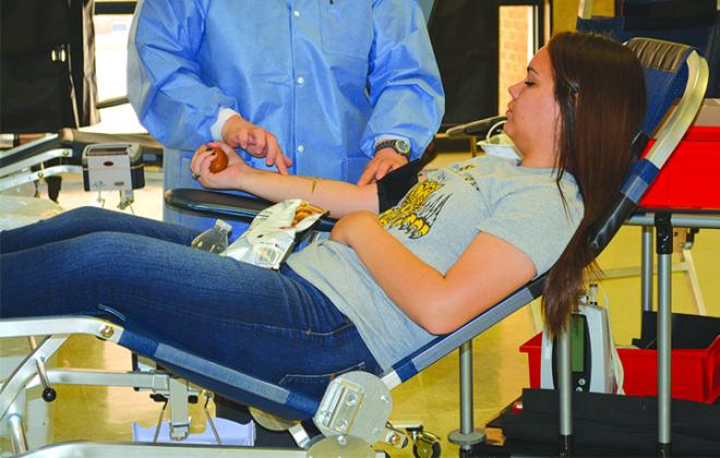 Senior Rayla Herrera donated blood Wednesday morning during the Snyder High School blood drive.