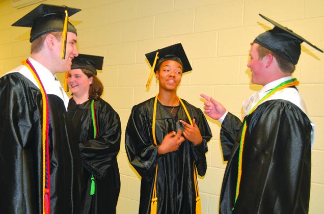 Snyder High School seniors (l-r) James Wampler, Tuesday Waltz, A’Nia Ware and Jax Weaver shared excitement for their commencement ceremony.
