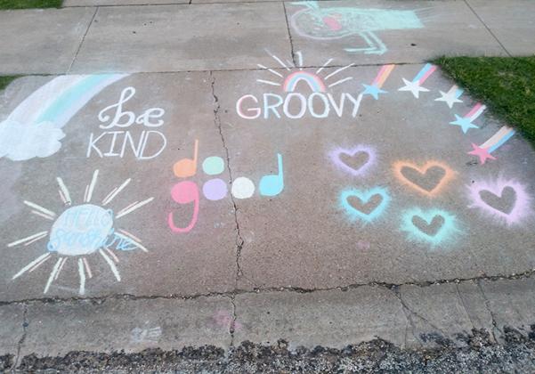Fourteen-year-old Emily Davis shared an uplifting message with her sidewalk chalk artwork. 