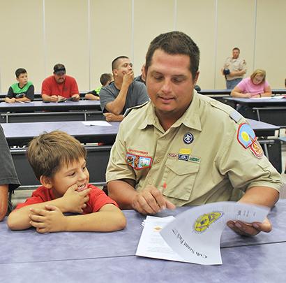 Eagle Scout Travis Heupel registered his son, Joshua Heupel, for Cub Scout Pack No. 177 with the Buffalo Trail Council Tuesday at Snyder Primary School.