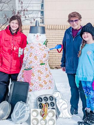 Pictured (l-r), Audrey Herrley, Patsy Hart and Aven Herrley made the bravest snow women baker. She stays cool outside while the oven is hot. 