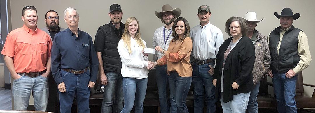 Snyder FFA member Kendra Bynum (fifth from left) received a scholarship check from Hunter Appreciation board members Tuesday. Pictured are (l-r) Reese Grimmett, Kenny Miller, Drew Bullard, Jason Bynum, Kendra Bynum, Snyder ISD teacher Jordan Gates, Jamie Price, Brad Hart, Melissa Kruger, Richard Kruger and Dennis Taylor.