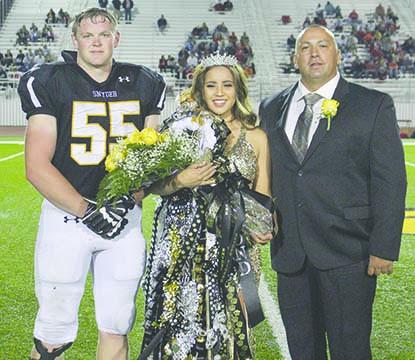 Ben McQuirk (left) was named king and Diamond Escobedo (center) was named the queen at Snyder High School homecoming Friday. Also pictured is Escobedo’s father,  Daniel Escobedo. 