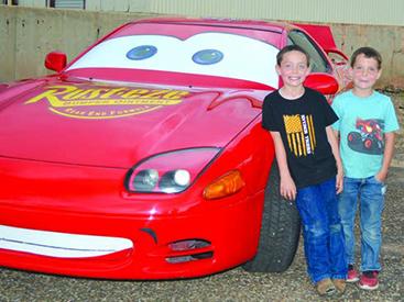 Dylan Curtis (left) and Dalton Curtis posed with Lightning McQueen during the Snyder Wheels Car Show and Cruise in Towle Park last year. 