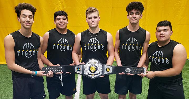 Snyder High School athletes (l-r) Aiden Salinas, Andres Rios, Troy Botts, Jaden Hernandez and Reyes Silva show off the championship belt after winning a competition day. The Tigers hold a competition day every Friday and the winner earns the belt and bragging rights.