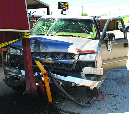 A pickup truck drove through the Sonic Drive-in parking lot, through a fence and into a pole Thursday morning. The driver of the truck was transported to Cogdell Memorial Hospital.