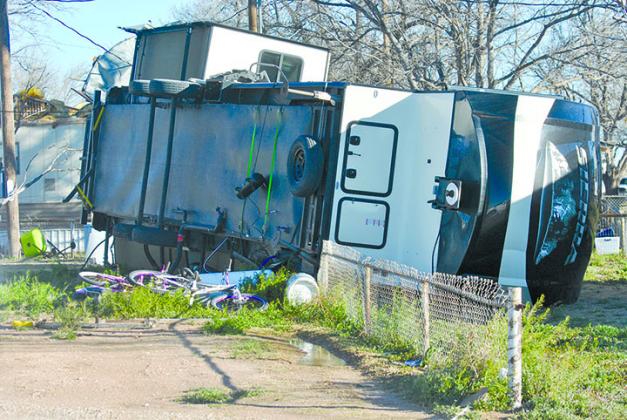 Wind gusts approaching 50 mph caused extensive damage in west and north­­ Snyder early this morning. One mobile home and a fifth-wheel trailer at the Trailertopia RV Park on West U.S. Hwy. 180 were toppled by the high winds.