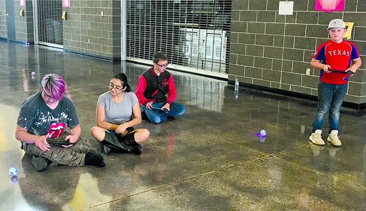 Incoming Snyder High School freshmen (l-r) Nicholas Martinez, Chelsea Diaz, Shad Hodge and Price Pinkerton worked with remote control cars during Tuesday’s Rising Tiger Camp.