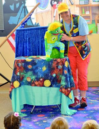 Tricia “Jolly Girl” Gregory and her puppet entertained children during the Scurry County LIbrary’s summer reading program awards ceremony today. Gregory and the puppets presented a program entitled Out of This World. Children’s Librarian Amy Hodges said program participants compiled 3,600 reading hours this year.