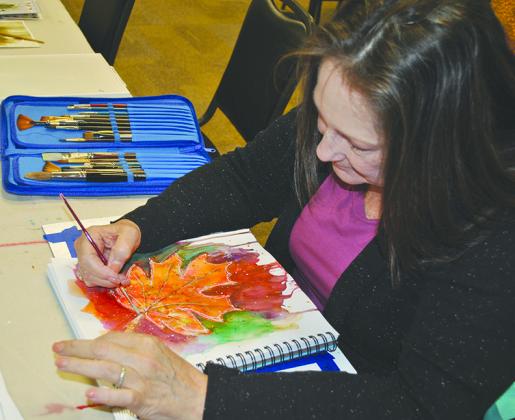 Suzan Pinkerton put the finishing touches on her leaf compositon during the Thursday Morning Watercolor class at Western Texas College’s College on the Square.